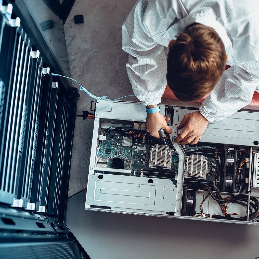 A person inspects server hardware