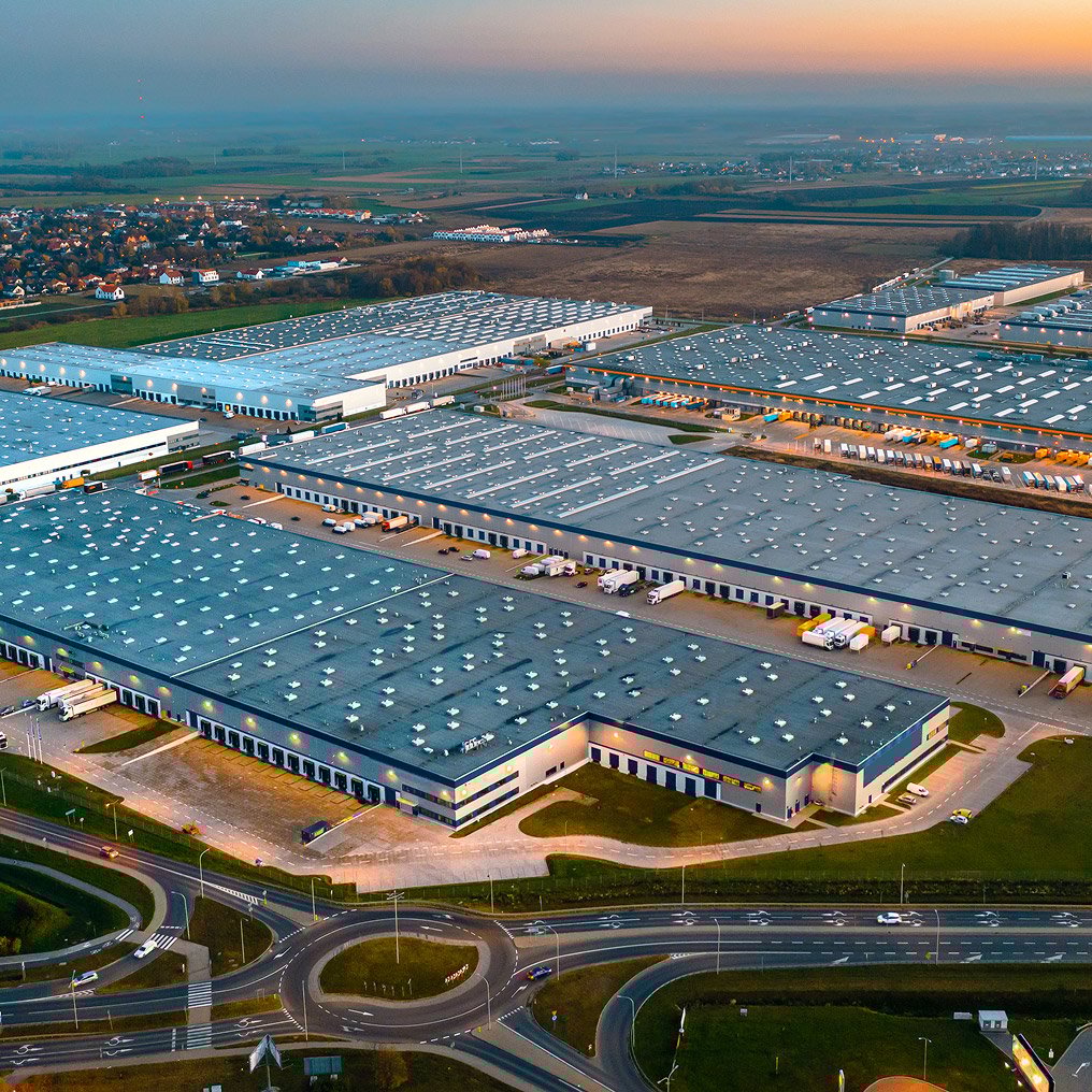 Aerial view of several large warehouses