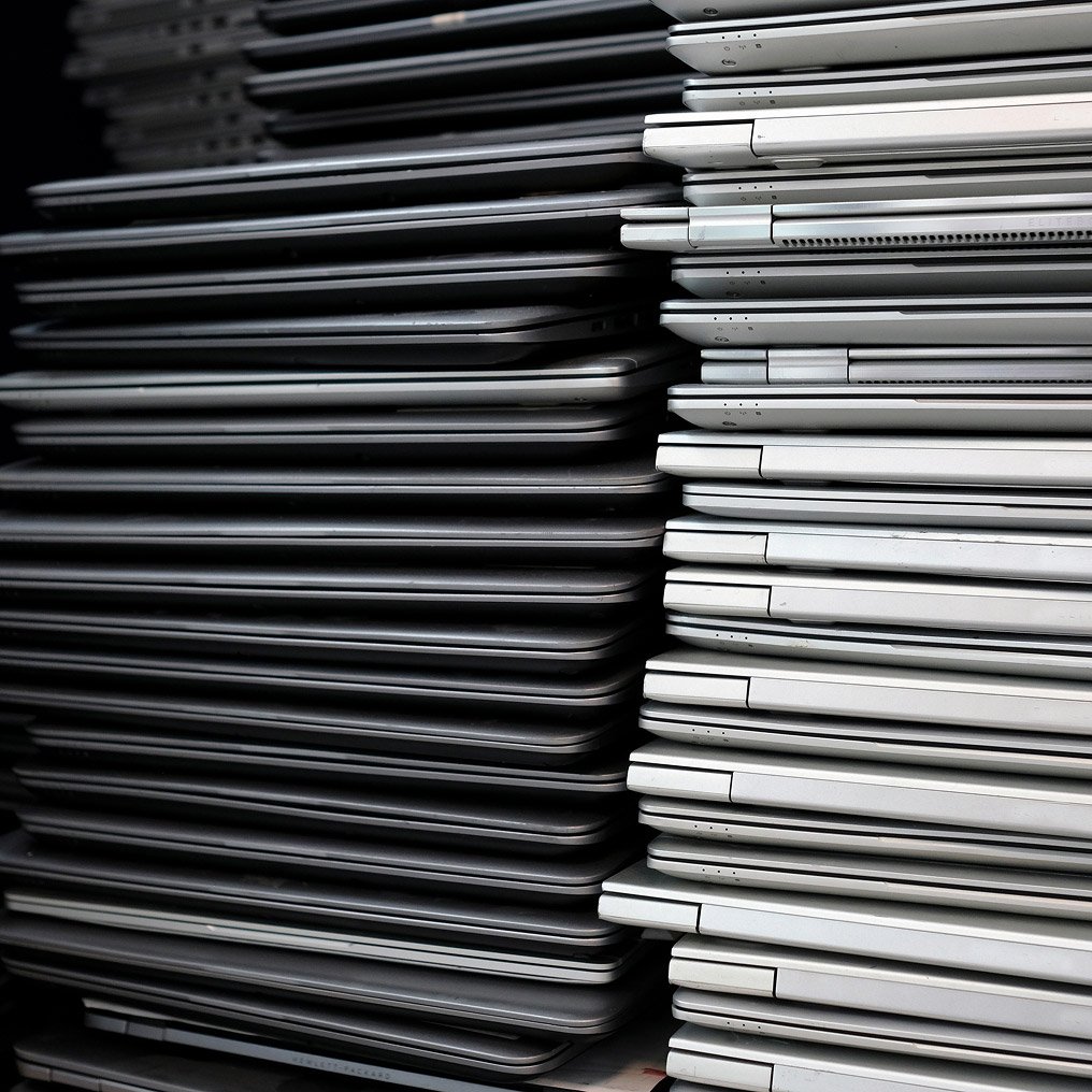 Image of stacked computer laptops