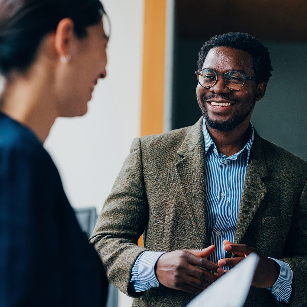 Two people exchange pleasantries